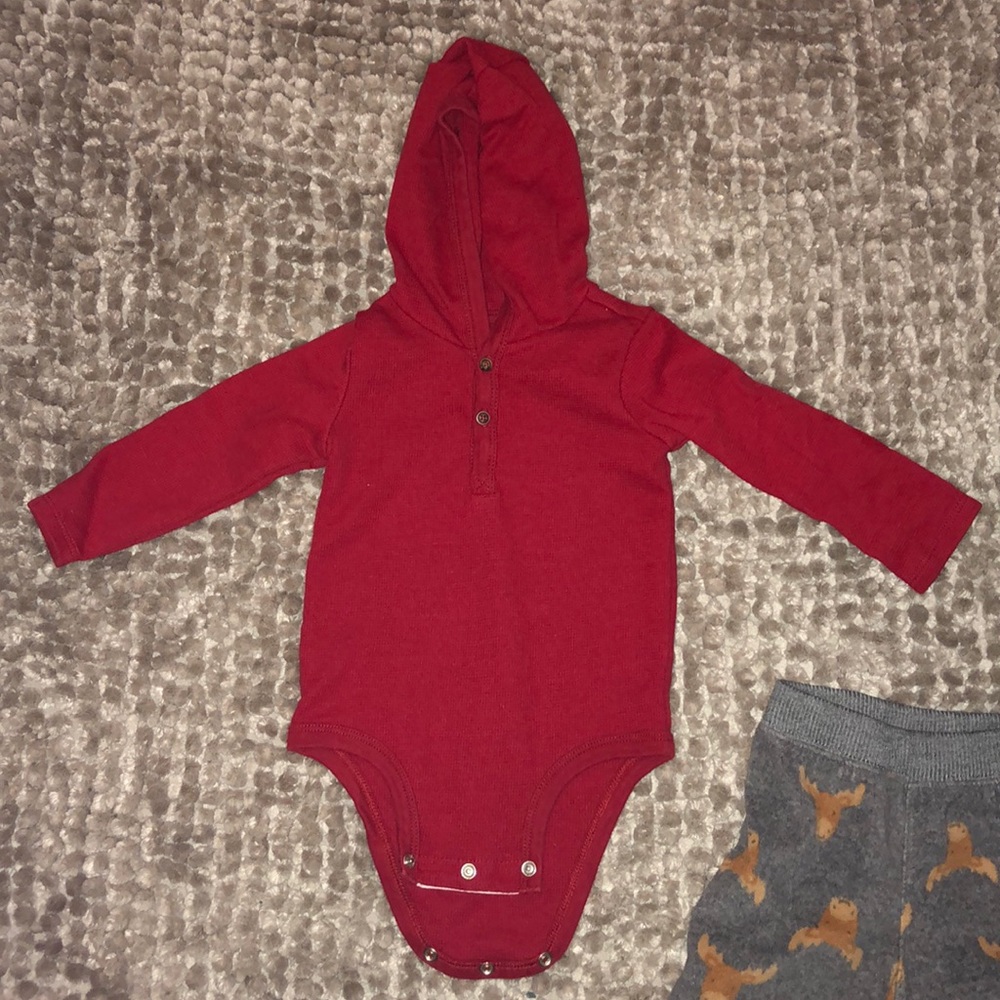 Two matching Carter’s outfits